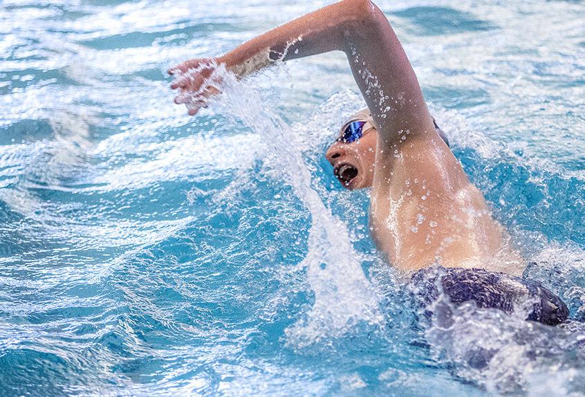 Boys swimmer racing